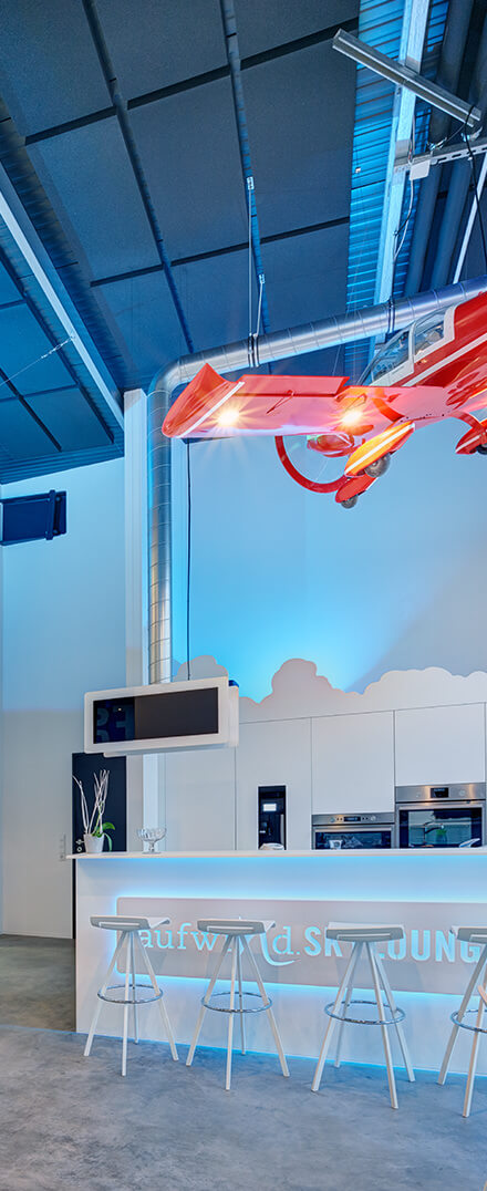 Plan sound absorbers on the ceiling of an advertising agency